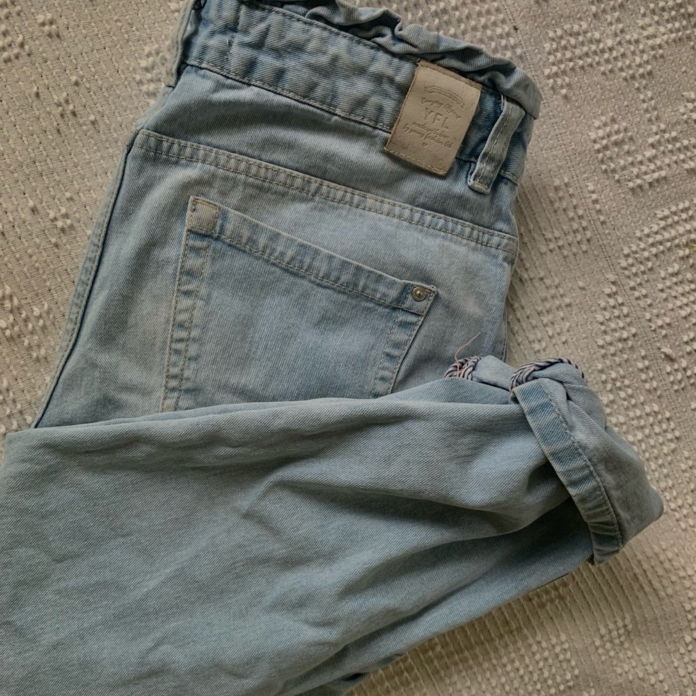 European light wash jeans with fringe wasteband